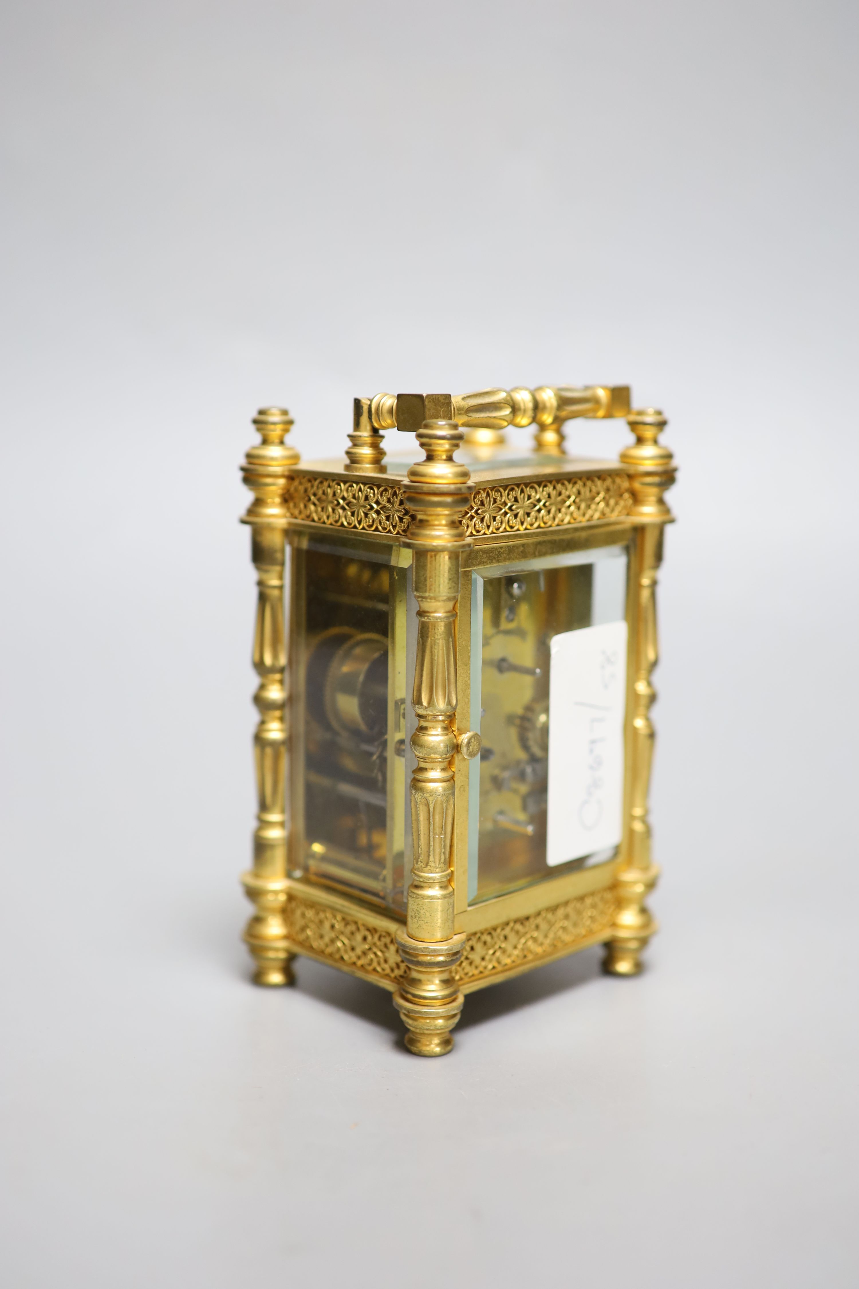 An early 20th century French brass carriage clock, with alarm, height 13.5cm with handle down